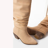 Beige slouchy over the knee boots, side view