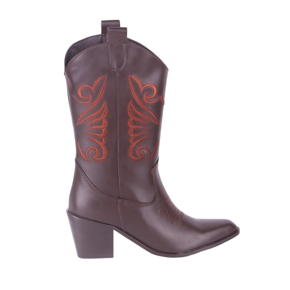 Brown embroidered cowboy boots, studio shot