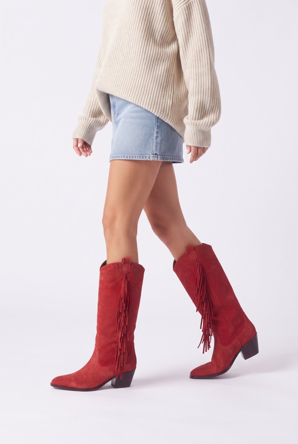 Red fringe cowboy boots on a model