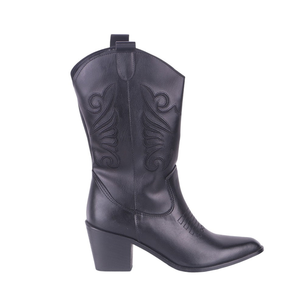 Black embroidered cowboy boots, studio shot