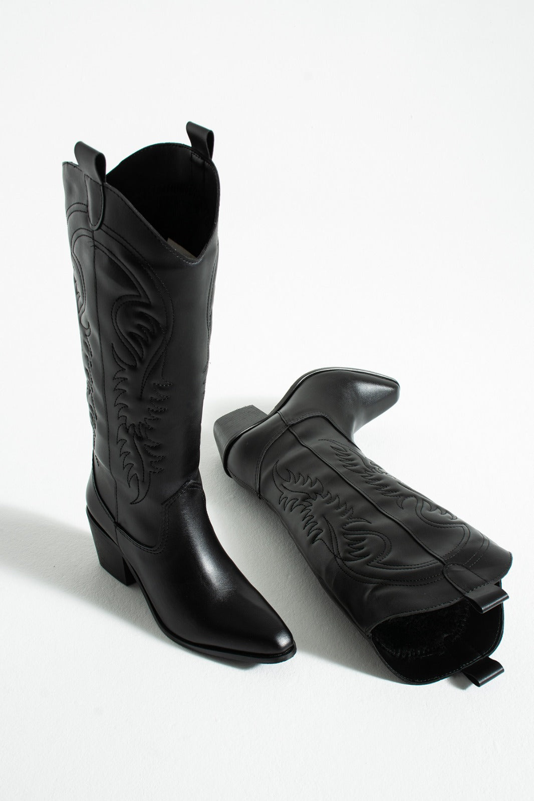 Black embroidered knee high cowboy boots, top view